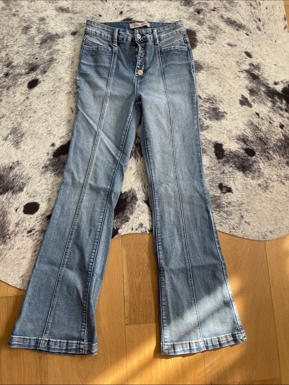 High-Rise Light Blue Flare Jeans with Button Front